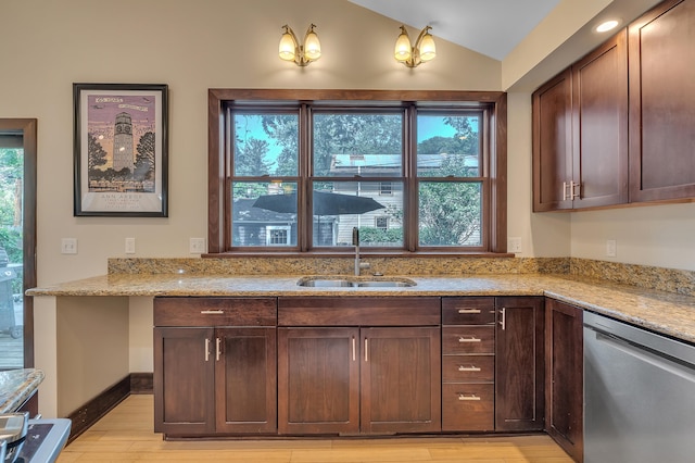 1115 Henry St, Ann Arbor, MI 48104 - kitchen featuring dishwasher, lofted ceiling, light stone counters, light wood-style floors, and dark brown cabinets