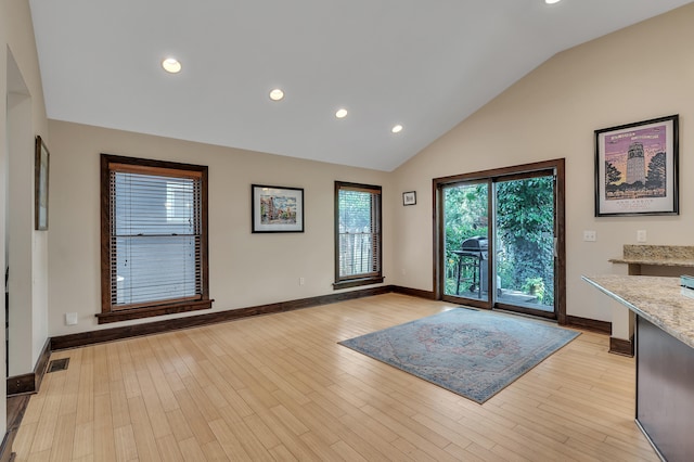 1115 Henry St, Ann Arbor, MI 48104 - doorway featuring recessed lighting, light wood-style flooring, and high vaulted ceiling