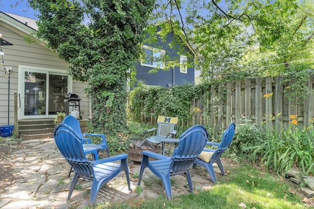 1115 Henry St, Ann Arbor, MI 48104 - view of yard featuring entry steps, an outdoor fire pit, and a patio
