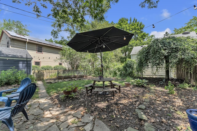 1115 Henry St, Ann Arbor, MI 48104 - fenced backyard with a patio