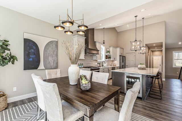 5215 Grande View Ln, Jackson, MI 49201 - dining area with recessed lighting, baseboards, dark wood-style floors, and wine cooler