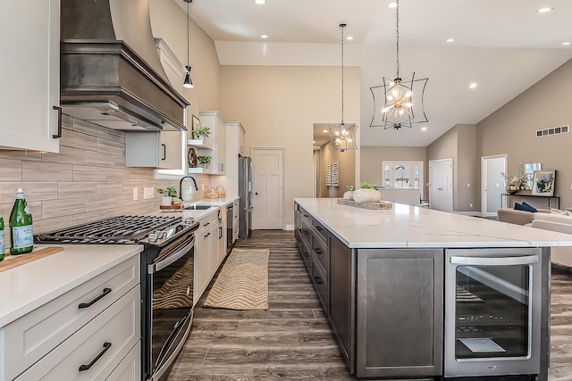 5215 Grande View Ln, Jackson, MI 49201 - kitchen featuring dark wood-style flooring, wine cooler, high vaulted ceiling, custom range hood, and stainless steel appliances