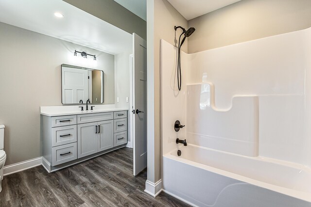 5215 Grande View Ln, Jackson, MI 49201 - full bathroom with shower / bathing tub combination, wood finished floors, baseboards, vanity, and toilet
