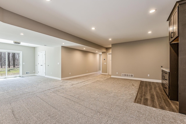 5215 Grande View Ln, Jackson, MI 49201 - unfurnished living room featuring recessed lighting, carpet, baseboards, and visible vents