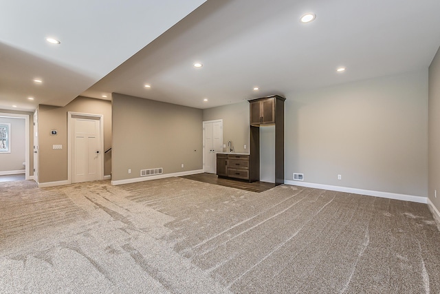 5215 Grande View Ln, Jackson, MI 49201 - unfurnished living room featuring carpet floors and visible vents