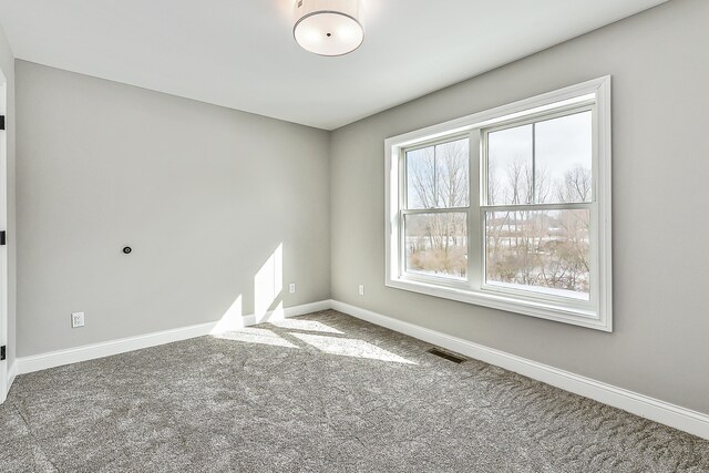 5182 Grande View Ln, Jackson, MI 49201 - carpeted empty room with baseboards and visible vents