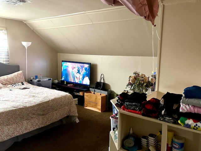 carpeted bedroom featuring visible vents and lofted ceiling