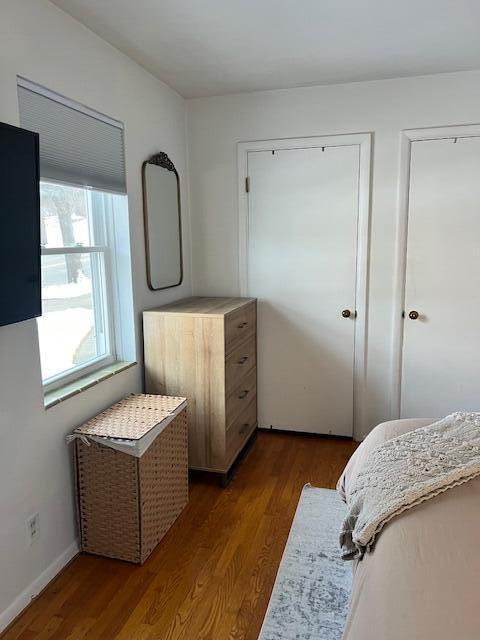 bedroom featuring wood finished floors
