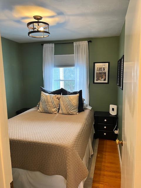 bedroom with wood finished floors
