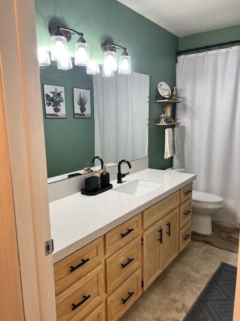 full bathroom with vanity and toilet