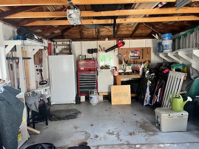 garage featuring freestanding refrigerator and refrigerator