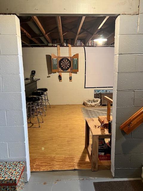 unfinished below grade area with concrete block wall