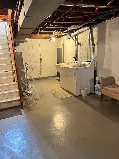 unfinished basement with washer and clothes dryer