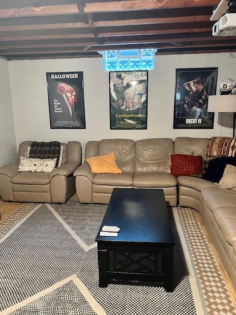 living room with concrete block wall