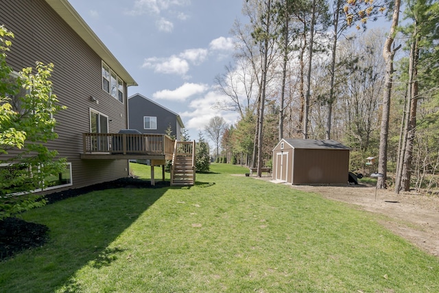 14411 Windway Dr, Grand Haven, MI 49417 - view of yard featuring a storage unit, stairs, a wooden deck, and an outdoor structure