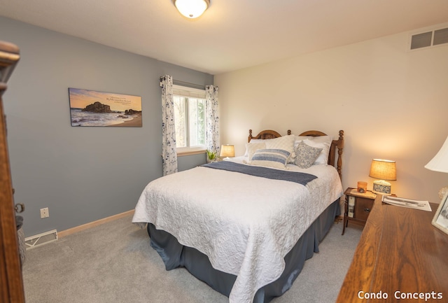 carpeted bedroom featuring baseboards and visible vents