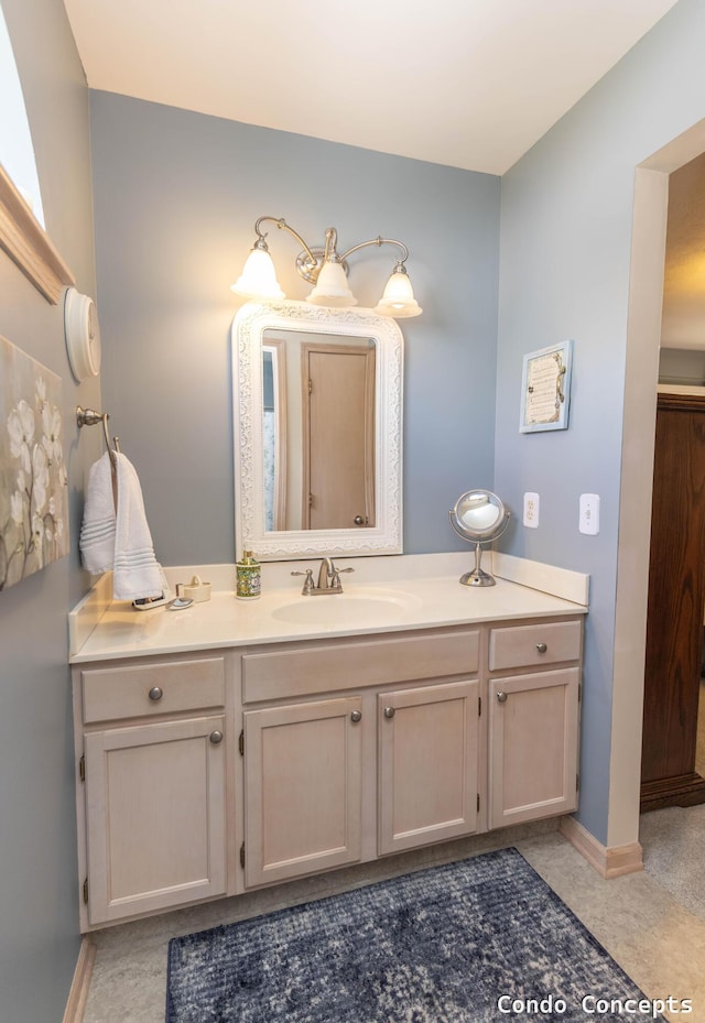 bathroom featuring vanity and baseboards