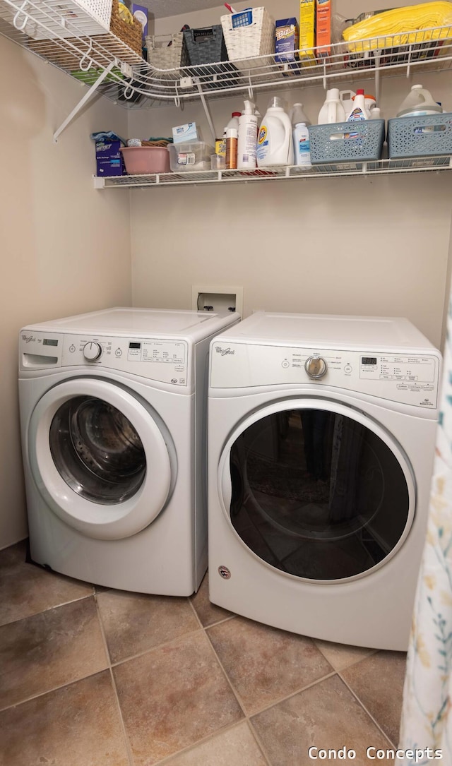 laundry room with independent washer and dryer, laundry area, and tile patterned floors