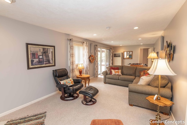 living area featuring carpet flooring, recessed lighting, and baseboards