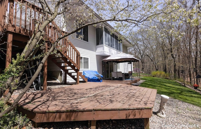 exterior space featuring a deck and a gazebo