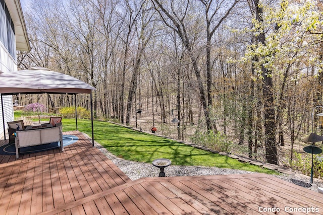 deck with a lawn and a gazebo