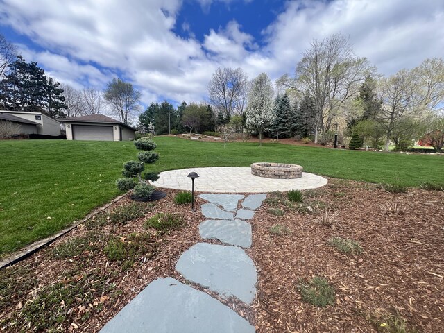 3817 Butterworth St SW, Grand Rapids, MI 49534 - view of grassy yard with an outdoor fire pit