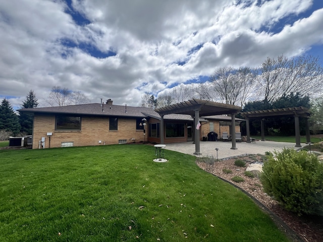3817 Butterworth St SW, Grand Rapids, MI 49534 - back of house featuring a pergola, a patio, a lawn, brick siding, and central AC unit