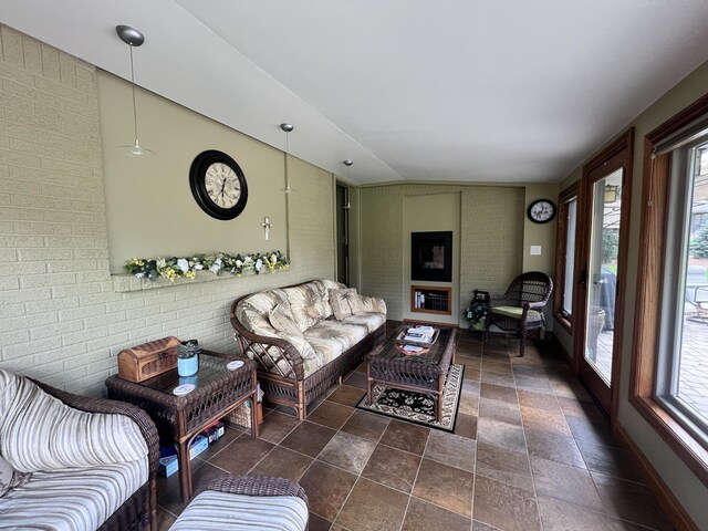 3817 Butterworth St SW, Grand Rapids, MI 49534 - living room with stone finish floors and brick wall