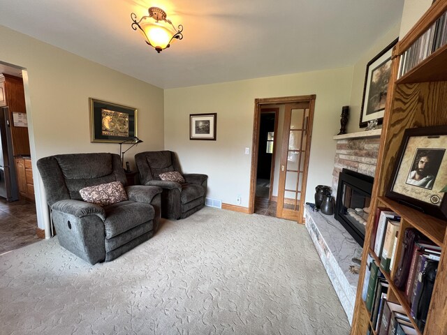 3817 Butterworth St SW, Grand Rapids, MI 49534 - living room with a stone fireplace and carpet flooring
