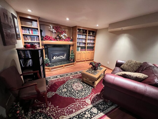 3817 Butterworth St SW, Grand Rapids, MI 49534 - living area featuring wood finished floors, a fireplace, and recessed lighting