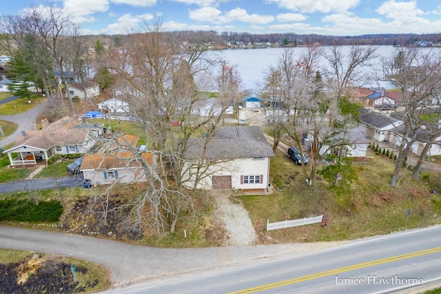 birds eye view of property with a residential view and a water view