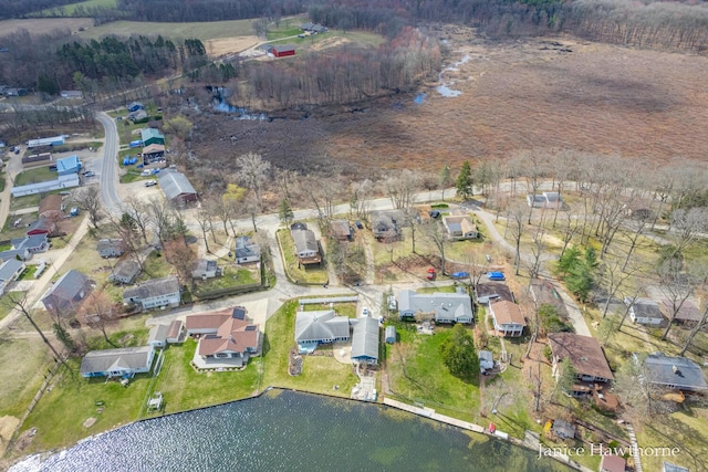 bird's eye view featuring a residential view and a water view