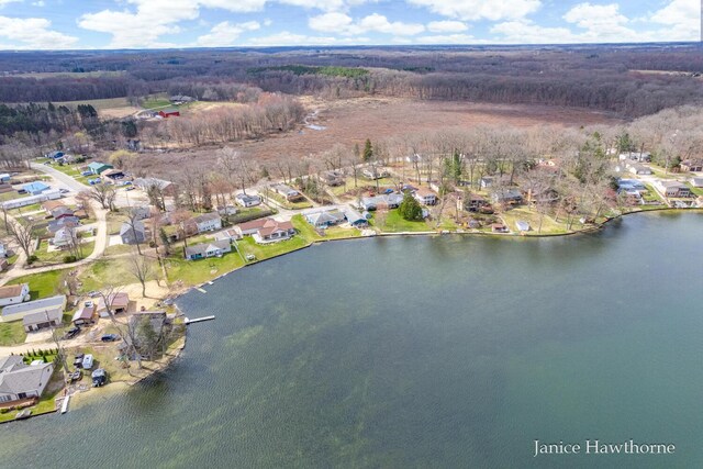 aerial view with a residential view and a water view
