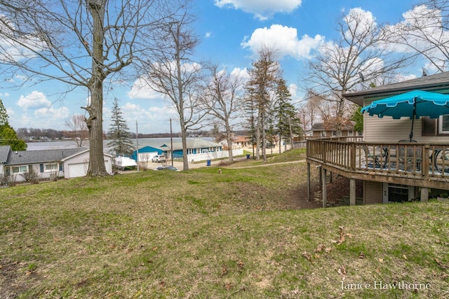 view of yard featuring a wooden deck
