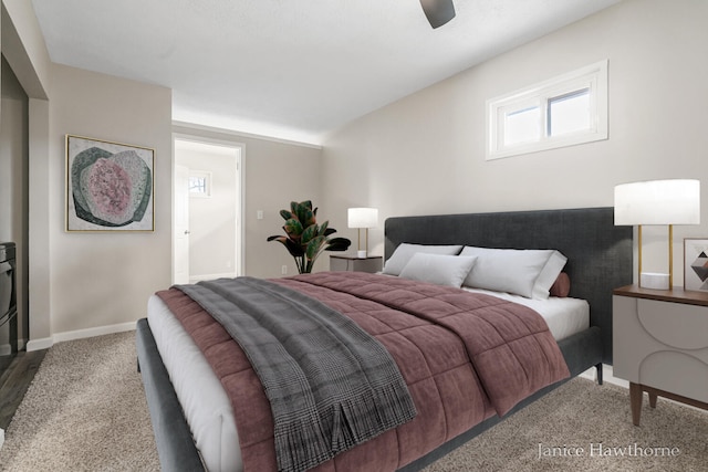 carpeted bedroom featuring ceiling fan and baseboards
