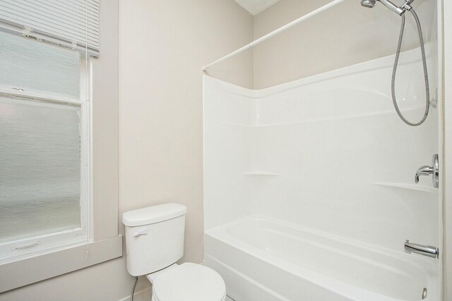 311 Robey Pl SE, Grand Rapids, MI 49506 - full bathroom with toilet, baseboards, and  shower combination