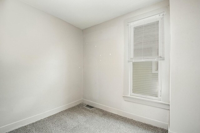 311 Robey Pl SE, Grand Rapids, MI 49506 - empty room with baseboards and light colored carpet