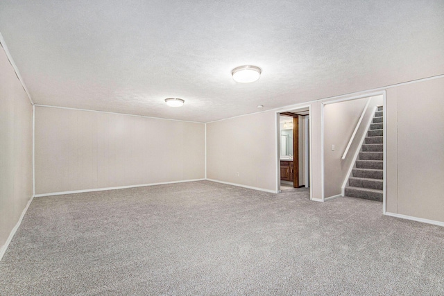 5984 Leisure S Dr SE, Grand Rapids, MI 49548 - finished below grade area featuring baseboards, carpet flooring, stairs, and a textured ceiling