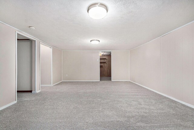 5984 Leisure S Dr SE, Grand Rapids, MI 49548 - carpeted spare room with baseboards and a textured ceiling