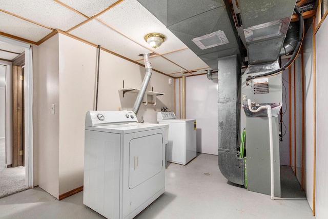 5984 Leisure S Dr SE, Grand Rapids, MI 49548 - clothes washing area featuring heating unit, laundry area, and washer and dryer