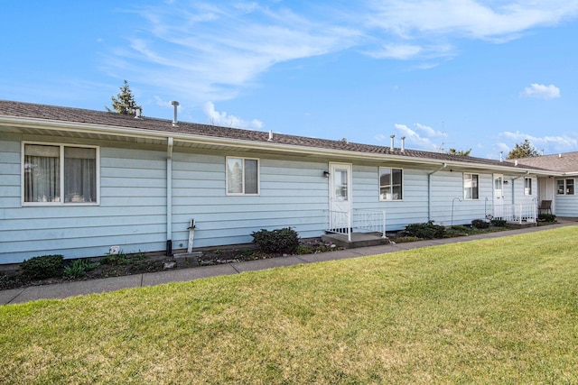 5984 Leisure S Dr SE, Grand Rapids, MI 49548 - back of property featuring a lawn