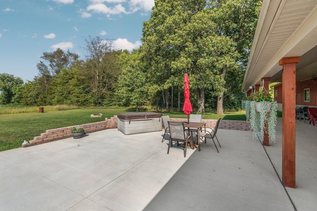 9528 Lee Rd, Jackson, MI 49201 - view of patio / terrace with outdoor dining area and a hot tub