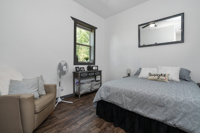 9528 Lee Rd, Jackson, MI 49201 - bedroom featuring baseboards and dark wood-style flooring