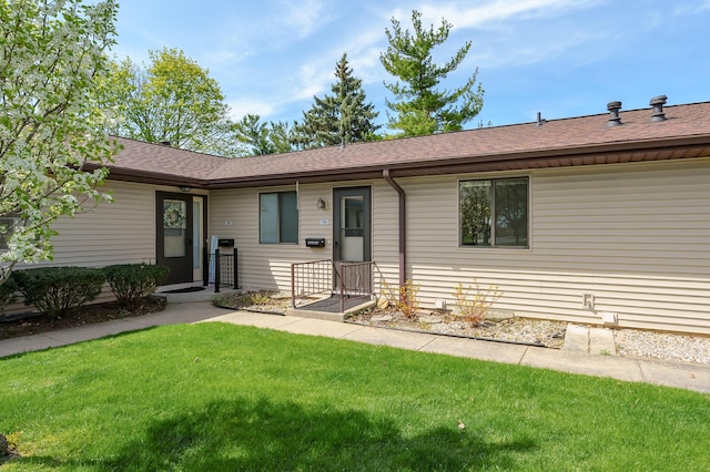 5160 Green Meadow Rd, Kalamazoo, MI 49009 - ranch-style home with a front lawn and roof with shingles