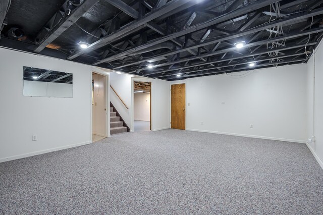 5160 Green Meadow Rd, Kalamazoo, MI 49009 - finished below grade area featuring stairway, carpet floors, and baseboards