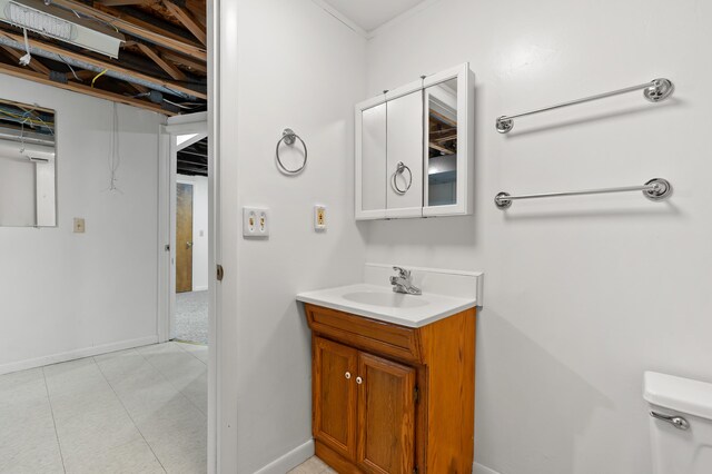 5160 Green Meadow Rd, Kalamazoo, MI 49009 - half bath with toilet, baseboards, tile patterned floors, and vanity