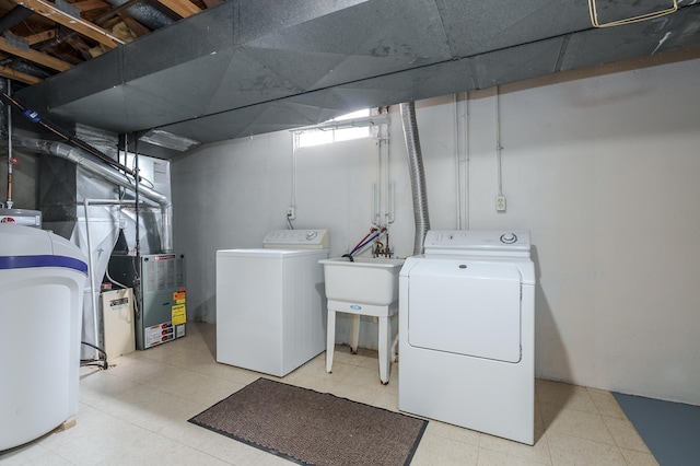 5160 Green Meadow Rd, Kalamazoo, MI 49009 - laundry area with laundry area, a sink, washing machine and dryer, and tile patterned floors