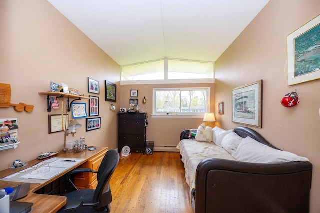 5009 John Holmes Rd, Ann Arbor, MI 48103 - home office with a baseboard heating unit, light wood-type flooring, and lofted ceiling