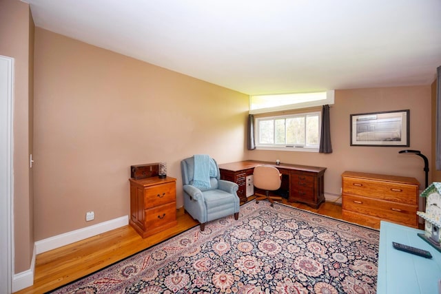 5009 John Holmes Rd, Ann Arbor, MI 48103 - sitting room with wood finished floors, baseboards, and a baseboard radiator