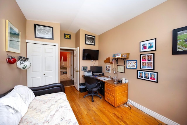 5009 John Holmes Rd, Ann Arbor, MI 48103 - office area with light wood-style floors, lofted ceiling, and baseboards